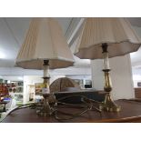 TWO BRASS BASED TABLE LAMPS WITH PLEATED PALE SHADES.