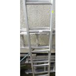 AN EXTENDING LOFT LADDER