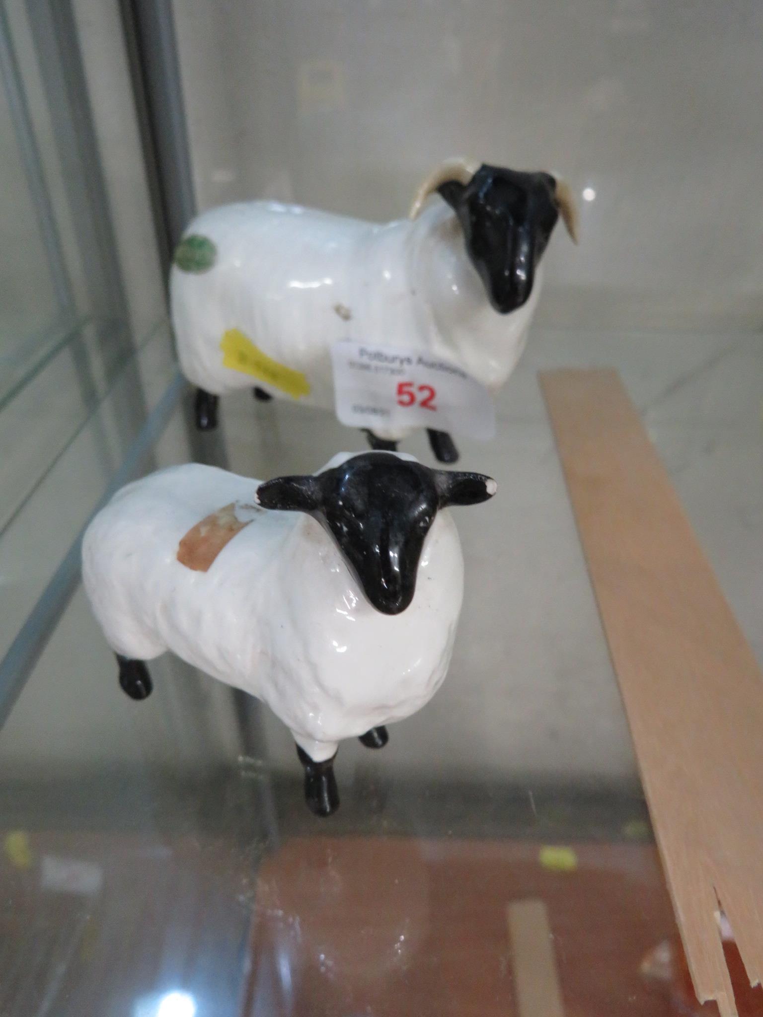 BESWICK FIGURE OF A HORNED SHEEP TOGETHER WITH LAMB. (AF)