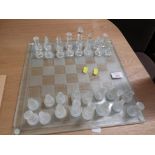 GLASS CHESS BOARD AND PIECES. (AF)