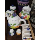 PURPLE GLAZED VASE SIGNED LILA FLORA HOLLAND, TOGETHER WITH FRUIT PATTERNED BREAKFAST WARE.