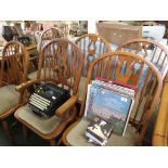 AN OAK AND MAHOGANY VENEER EXTENDING DINING TABLE, WITH A SET OF SIX SPINDLE BACK DINING CHAIRS (