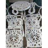 A CIRCULAR METAL PATIO TABLE WITH FOUR METAL CHAIRS PAINTED WHITE. (AF)
