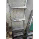 A THREE-WAY ALUMINIUM LADDER.