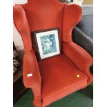 A GEORGIAN STYLE WINGBACK ARM CHAIR, HORSE HAIR STUFFED RED UPHOLSTERY, ON FRONT BALL AND CLAW FEET.