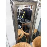 LONG RECTANGULAR BEVEL EDGED MIRROR IN A BRUSH METAL EFFECT FRAME.