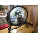 MAHOGANY FRAMED OVAL SWING MIRROR.