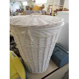 WHITE PAINTED WICKER LAUNDRY BASKET.
