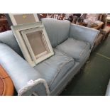 AN EDWARDIAN SCROLL END TWO SEATER SOFA WITH MORE RECENT PALE BLUE UPHOLSTERY.