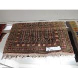 A BROWN GROUND MIDDLE EASTERN PRAYER RUG 132 BY 94 CM.