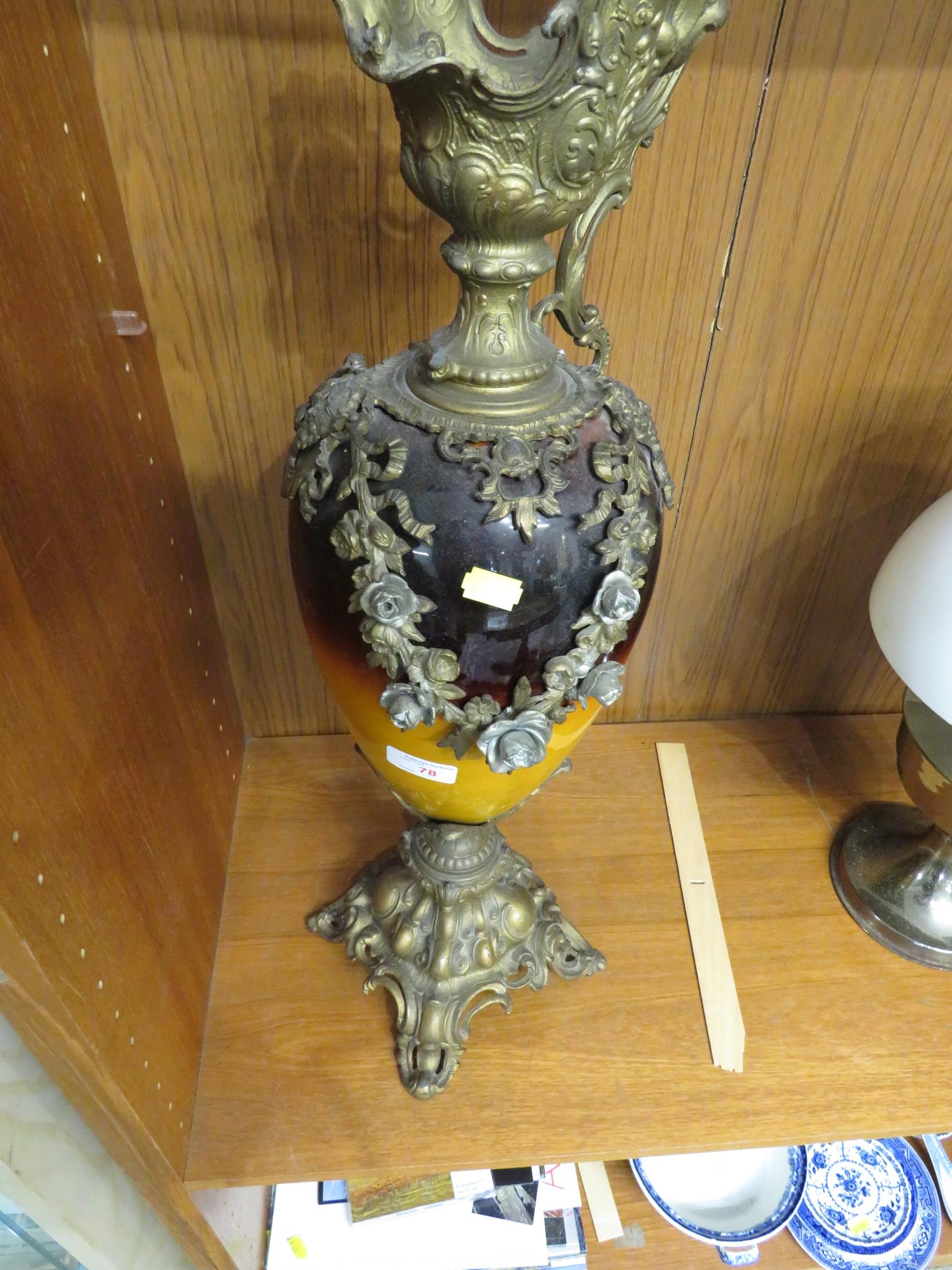 GILT CAST METAL URN WITH POTTERY BODY.