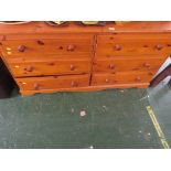 LOW HONEY PINE CHEST OF SIX DRAWERS.