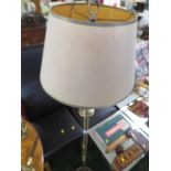 BRASS EFFECT FLOOR STANDING ELBOW LAMP WITH SHADE.