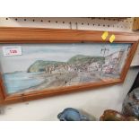 A PRINT OF SIDMOUTH SEA FRONT, GLAZED AND IN A PINE FRAME