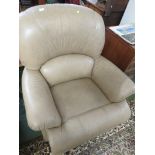 ARMCHAIR IN PALE BROWN FAUX LEATHER.