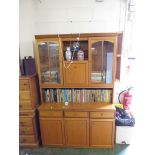 TEAK ILLUMINATED LOUNGE DISPLAY UNIT WITH TWO GLAZED DOORS TO TOP, CUTLERY DRAWER AND TWO