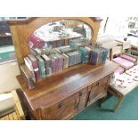 LATE 19TH / EARLY 20TH CENTURY OAK SIDEBOARD WITH OVAL MIRROR BACK, TWO DRAWERS OVER TWO CUPBOARD