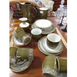POOLE POTTERY COFFEE AND PART DINNER WARE IN AN OLIVE GLAZE.