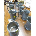 NINE LATE 19TH AND EARLY 20TH CENTURY PEWTER TANKARDS.