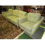 ERCOL THREE PIECE SUITE UPHOLSTERED IN PALE GREEN WITH LIGHT WOOD LEGS.