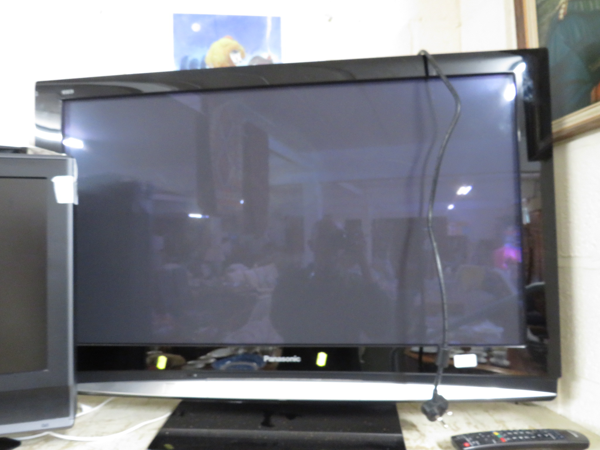 A PANASONIC VIERA 42 INCH TH-42PZ80B PLASMA TELEVISION WITH REMOTE