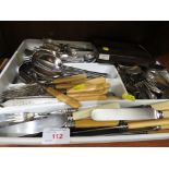 A PLASTIC TRAY OF ASSORTED SILVER-PLATED AND BONE HANDLED CUTLERY