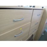 LIGHT WOOD EFFECT BEDROOM SUITE COMPRISING A FOUR DOOR WARDROBE, SIX DRAWER CHEST AND A PAIR OF