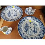 TWO BLUE AND WHITE PATTERNED LEAD GLAZED PLATES , BLUE AND WHITE PORCELAIN CHAMBER STICK AND A