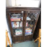 OLD CHARM FURNITURE STAINED OAK BOOK CASE WITH GLAZED LEADED DOORS. *