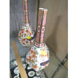 PAIR OF ORIENTAL STYLE PORCELAIN STEM VASES WITH FLORAL DECORATION (A/F)