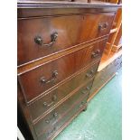 A MAHOGANY VENEERED REPRODUCTION CHEST OF FIVE DRAWERS WITH METAL HANDLES.