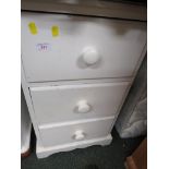 WHITE PAINTED THREE DRAWER PINE BEDSIDE.