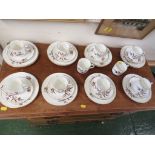 WHITE CHINA PART COFFEE SERVICE DECORATED WITH FLOWERS AND BRANCHES. (AF)