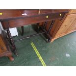 VICTORIAN ROSE WOOD VENEERED TABLE WITH SINGLE DRAWER, TURNED SUPPORTS AND STANDING ON BRASS