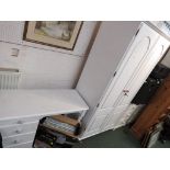 WHITE PAINTED HONEY PINE TWO DOOR WARDROBE AND TWO DRAWER DRESSING TABLE.
