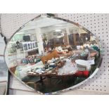 JOHN HALL SHAPED BEVEL EDGED FRAMELESS MIRROR.