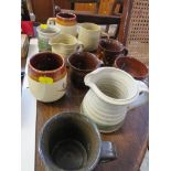 SELECTION OF POTTERY MUGS AND JUGS. *