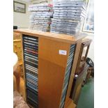 LARGE SELECTION OF POP , ROCK , CLASSICAL AND EASY LISTENING CD'S CONTAINED WITHIN A WOOD VENEERED