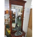 MAHOGANY VENEERED HALL STAND WITH MIRROR BACK AND BRASS HOOKS.