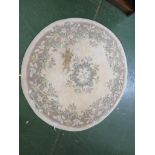 BEIGE GROUND CIRCULAR FLOOR RUG. *