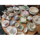 LARGE ASSORTMENT OF CHINA TEA WARE INCLUDING CUPS, SAUCERS, SIDE PLATES ETC.