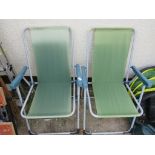 TWO PLASTIC OUTDOOR FOLDING CHAIRS. (AF)*