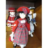THREE CHINA COLLECTORS DOLLS ON STANDS. *