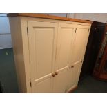 CREAM PAINTED COMPOSITE PINE THREE DOOR WARDROBE.