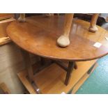 AN OVAL MAHOGANY FOLDING TABLE*