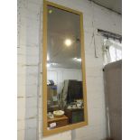 RECTANGULAR WALL MIRROR IN A WOOD EFFECT FRAME. *