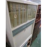 A VINTAGE CREAM PAINTED REMPLOY KITCHEN CABINET.