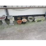 A SELECTION OF COMPOSITE STONE AND TERRERCOTA PLANTERS TOGETHER WITH TWO COMPOSITE BIRD BATHS.