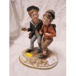CONTINENTAL PORCELAIN FIGURAL GROUP OF TWO BOYS.