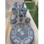 WEDGWOOD BLUE JASPER WARE ITEMS INCLUDING CANDLE STICKS , PAPERWEIGHT AND OTHER ITEMS.